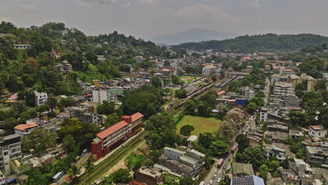 Kandy-Sri-Lanka-Aerial-v10-drone-flyover-the-major-transportation-hub,-the-railway-station-in-Deiyannewela-capturing-views-of-city-center-and-hillside-cityscape---Shot-with-Mavic-3-Cine---April-2023