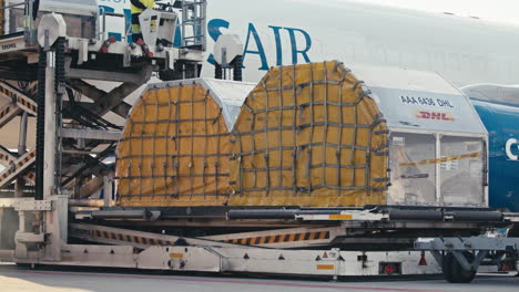 Air-cargo-pallet-loading-onto-Boeing-757-freight-aircraft-with-special-airport-ULD-equipment