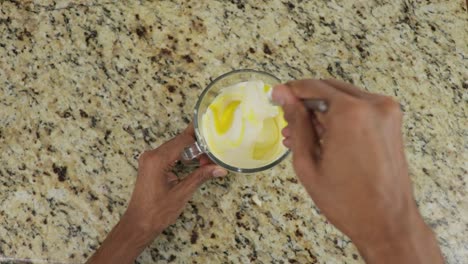 Mixing-mayonnaise-and-mustard-into-cream,-making-sauce-at-home