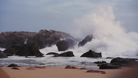 Majestic-Waves-Break-on-Serene-Beach-Boulders
