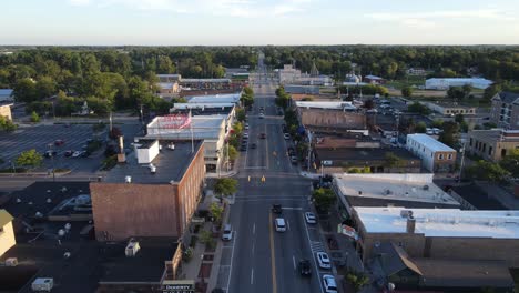 Clare-township-with-few-cars-driving-in-downtown,-aerial-view