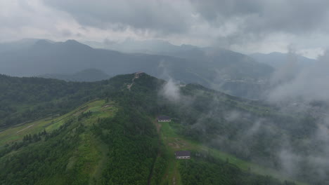 Aerial-tracking-shot-over-clouds-in-the-Joshinetsu-National-Park-in-gloomy-Japan