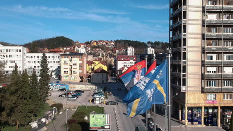 Uzice-City-and-National-Serbian-Flag-Waving-on-Wind-in-Downtown-on-Sunny-Day