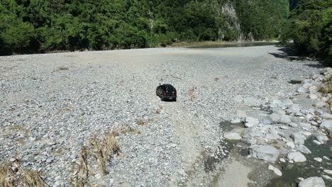 Off-road-vehicles-4x4-on-riverbank,-Muchas-Aguas-in-Dominican-Republic