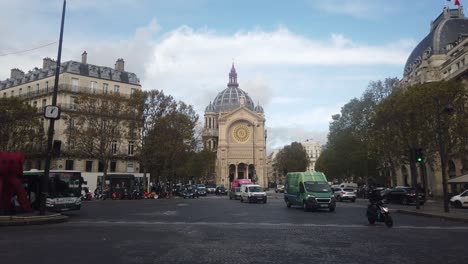 Traffic-at-instersection-by-Church-of-Saint-Augustin-in-Paris