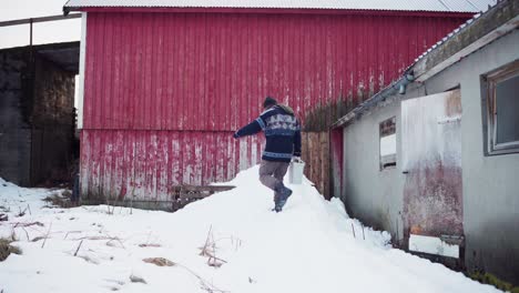 Man-Walking-Out-From-Farm-House-To-Throw-Garbage-Outdoor-In-Winter