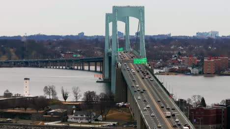 An-aerial-view-of-the-Throgs-Neck-Bridge-from-over-the-Long-Island-Sound,-NY-on-a-cloudy-day