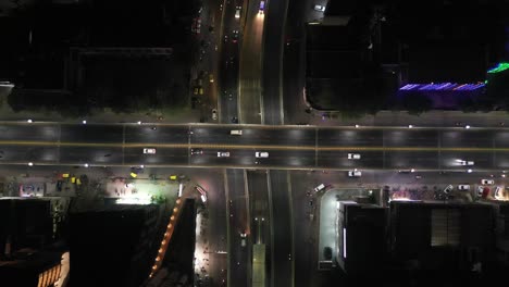 Rajkot-aerial-drone-view-drone-camera-shows-many-vehicles,-bikes,-ambulances,-over-and-under-bridges