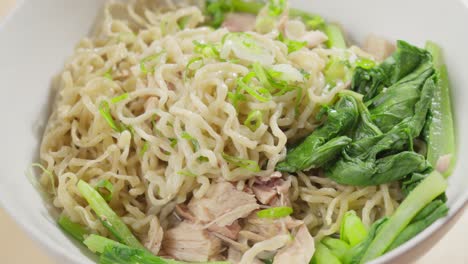 Green-Onions-Sprinkled-On-Bakmi-Wheat-Based-Noodles-In-A-Bowl