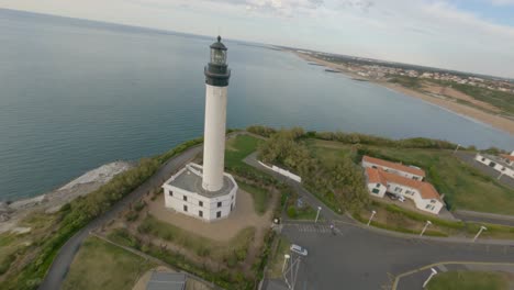Drone-flying-around-Biarritz-Lighthouse,-France.-Aerial-FPV