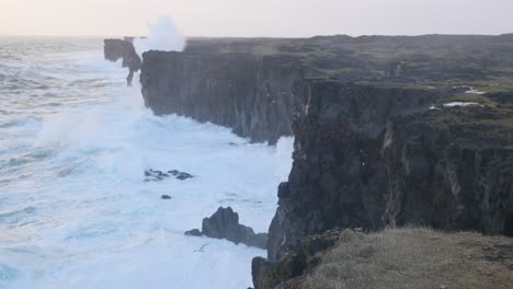 Waves-Crashing-On-Basalt-Cliffs-By-The-Arnarstapi-In-Snaefellsnes-Peninsula,-Iceland