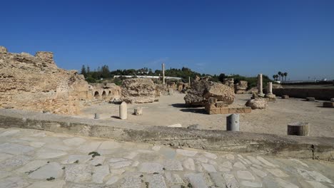 Sunny-day-at-the-ancient-Roman-ruins-in-Carthage,-Tunisia,-showcasing-historical-architecture