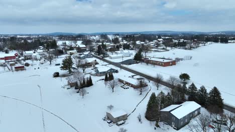Snowy-winter-landscape-in-suburb-village-of-USA