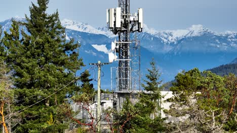 Telecommunications-Tower-At-Horseshoe-Bay-With-Scenic-View-Of-Mountain-Range-In-The-Background-In-BC,-Canada