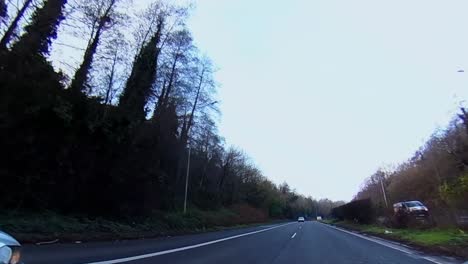 Car-POV-driving-along-M6-highway-out-to-Clonmacnoise-under-overcast-sky-Dublin-Ireland