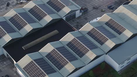 Aerial-view-of-building-with-solar-panels-stations-on-the-roof,-Netherlands