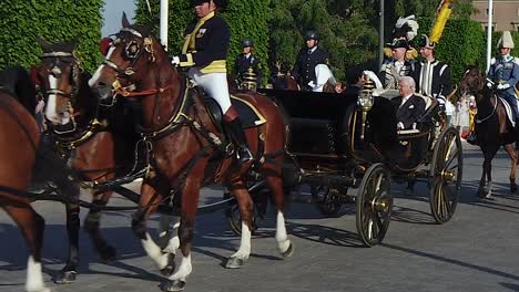 Swedish-King-Carl-XVI-Gustav-and-Queen-Silvia-ride-in-a-horse-drawn-carriage-on-National-Day-in-Stockholm