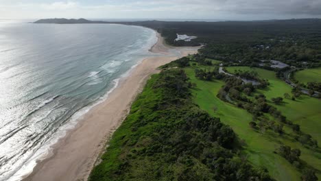 Tranquil-Scenery-Of-Belongil-Beach-And-Creek,-Byron-Bay,-NSW,-Australia---Aerial-Drone-Shot