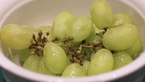 Fresh-green-grapes,-ready-to-be-eaten,-are-seen-in-a-white-bowl