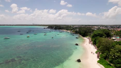 North-beach-in-mauritius-with-turquoise-water-and-anchored-boats,-aerial-view