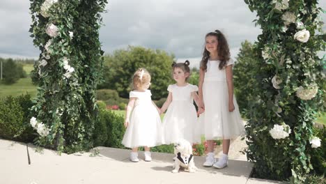 Young-children,-floral-wedding-photoshoot-with-small-family-canine