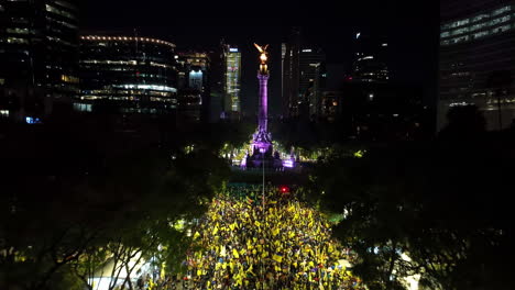 Drone-flying-over-soccer-champion-celebrations-at-the-Angel-of-Independence,-in-CDMX