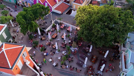 People-roam-streets-and-sit-at-open-air-tables-in-vibrant-buildings-of-Kura-Hulanda-village-in-Otrobanda-Willemstad-Curacao