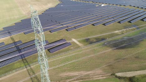 aerial-view-on-power-pole-utility-high-angle-tilt-on-solar-farm-panel
