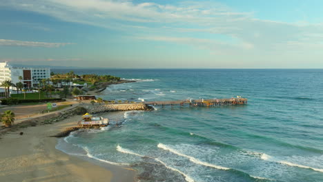 Protaras-Pier-and-Cyprus-Island-Coastline-at-Tranquil-Sunset---Aerial-Side-View