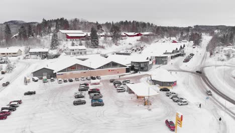 Sannidal,-Telemark-County,-Norway---Alti-Kragero-Shopping-Mall-is-Draped-in-Snow-on-Winter-Day---Aerial-Panning