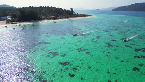 beach-rocky-cliff-island-turquoise-blue-sea