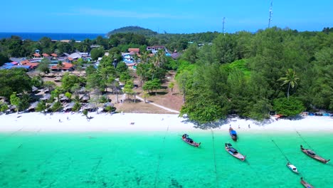 dream-beach-longtail-boats-in-turquoise-water