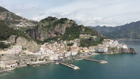Amalfi-coast-with-picturesque-houses-and-clear-waters,-daylight,-aerial-view