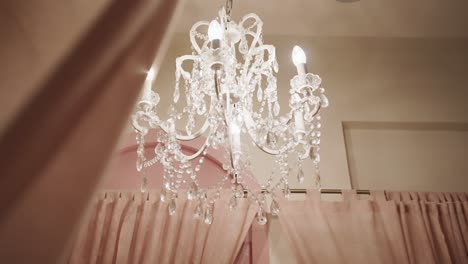 Crystal-Chandelier-Inside-A-Bedroom