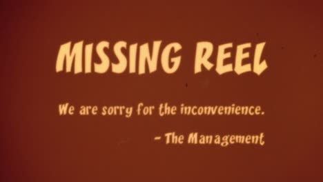 Intertitle-projected-onto-an-aged-theater-screen-The-Management