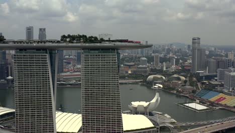 Marina-Bay-Sands-Hotel-with-Singapore-City-Harbor-in-the-Background-from-an-Aerial-Drone