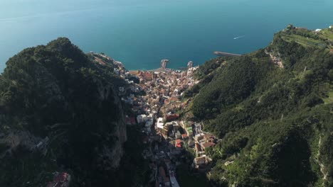 Amalfi-coast-town-nestled-between-sea-and-mountains,-italy,-aerial-view