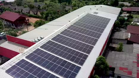 4k-Aerial-of-Warehouse-Solar-Rooftop,-Drone