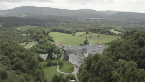 Royal-Collegiate-of-Roncesvalles-or-Roncevaux-and-surrounding-landscape,-Navarre-in-Spain