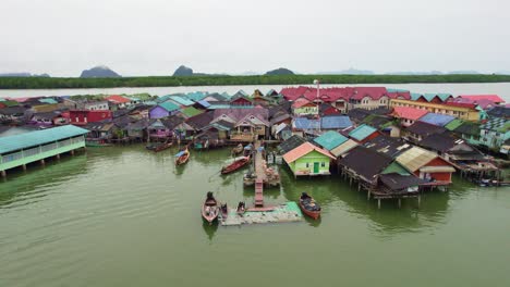 Aerial-Pull-Out-Shot-Over-Floating-Village-at-Panyee-Island,-Phang-Nga-Bay,-Thailand