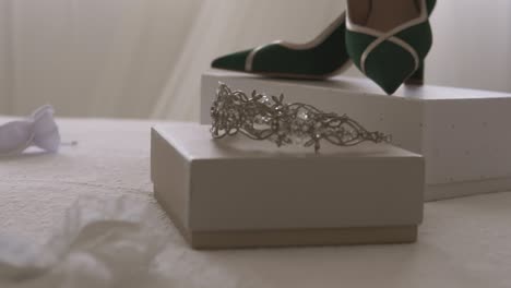 Close-up-shot-of-high-heels-and-tiara-showcased-before-wedding-ceremony