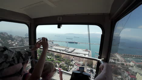 View-POV-of-the-docks-from-touristic-cable-car-tramway-in-Gibraltar-UK-overseas-territory