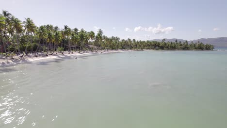 Smooth-aerial-dolly-establishes-beautiful-white-sand-of-Asserradero-Samana-Dominican-Republic