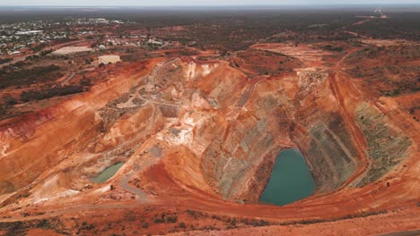 aerial-view-over-a-mine-pit-in-Kalgoorlie-Boulder-during-the-day,-australian-mining-city-in-Western-Australia