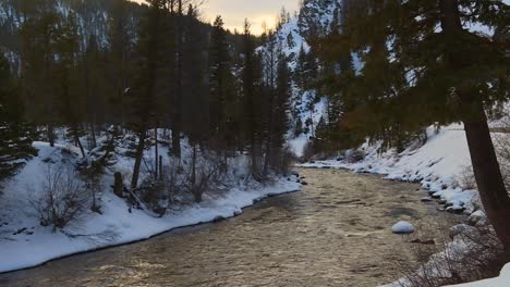 River-Flowing-In-The-Snowy-Woods-In-Boise-National-Forest-During-Winter-In-USA