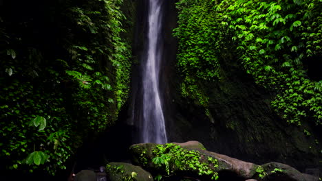 Scenic-Leke-Leke-waterfall-plunges-through-leafy-foliage-on-cliff-in-Bali-jungle