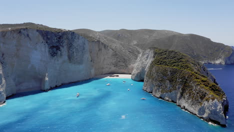 Aerial:-Orbit-shot-of-Navagio-beach-in-Zakynthos-Island,-Greece