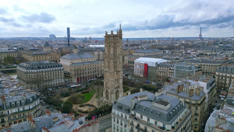 Saint-Jacques-Tower-and-square-with-Tour-Eiffel-in-background,-Boulevard-de-Sebastopol-at-Paris-in-France