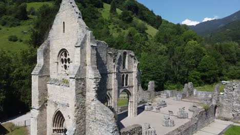 An-arc-shot-of-old-church-ruins-taken-by-a-drone-in-the-french-alps