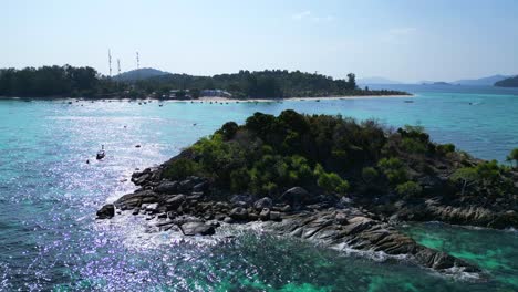 beach-rocky-cliff-island-turquoise-blue-sea